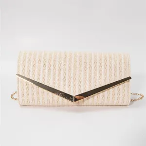 Detailed close-up view of the elegant woven clutch bag featuring metallic V-shape closure.