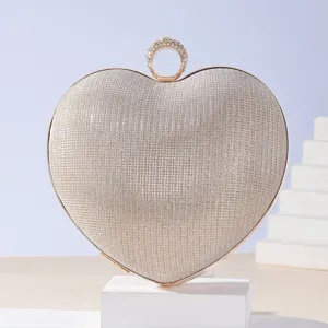 Elegant heart-shaped rhinestone evening clutch with ring handle for formal dress parties.
