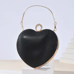 Black crystal heart evening bag with rhinestone and gold metal handle for parties and weddings.