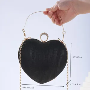 Elegant heart-shaped evening clutch bag with sparkling rhinestones and metal chain handle.