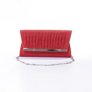 Detailed shot of the red glitter evening clutch bag with metallic bar and chain strap.