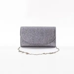 Silver glitter clutch bag detail, evening party shoulder bag with metallic chain strap.