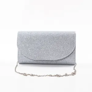 Silver glitter evening clutch bag with chain strap, perfect for party and formal events.