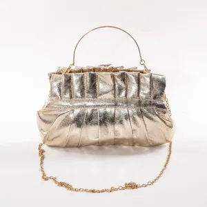 Gold pleated PU clutch bag with metal handle and chain strap for women evening party.