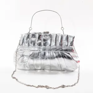 Silver pleated PU clutch bag detail, metal top handle and chain strap for evening events.