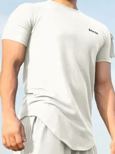 Detail view of men's casual textured short sleeve t-shirt and shorts set in light color.