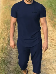 Men's casual short sleeve t-shirt and cargo shorts set, loose breathable summer outfit for daily wear.