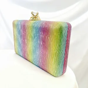 Rainbow wave texture evening clutch detail, crystal ring clasp design, exquisite hardware.