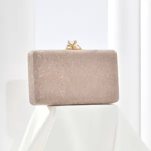 Elegant champagne glitter evening clutch bag with sparkling rhinestone gold clasp for women.