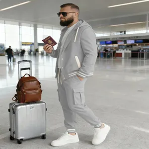 Detailed view of men's grey hooded cardigan tracksuit with cargo pants in airport setting.