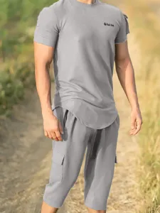 Detailed view of mens casual short sleeve t-shirt and cargo shorts set in solid grey.
