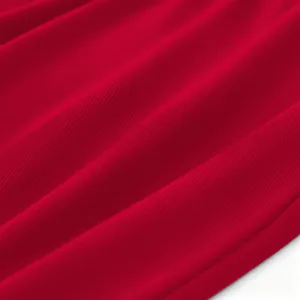 Red fabric material close up detailed texture view smooth textile surface soft fabric