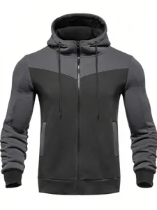 Men's colorblock zip-up hooded sweatshirt detail showing the textured fabric and pocket design.
