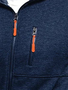 Close-up detail of dark blue fleece jacket chest with bright orange zipper pulls.