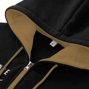 Men's contrast zip-up hoodie detail view showcasing the stylish hood, drawstring and zipper.