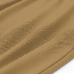 Brown fabric texture detail close up view showing soft knit material and drapery folds