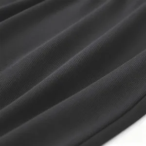 Close-up fabric detail of men's casual hoodie, showing soft and textured dark knit material.