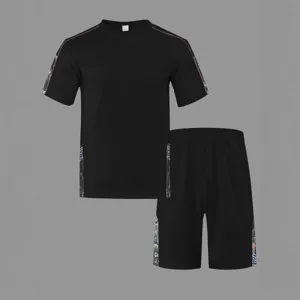 Men's casual black waffle short sleeve T-shirt and shorts set with stylish side print tapes.