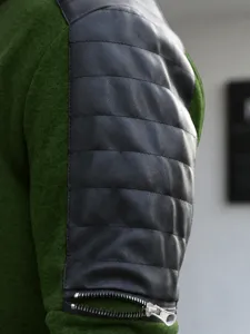 Men's casual sports jacket sleeve detail, stylish colorblock design with zipper decoration.