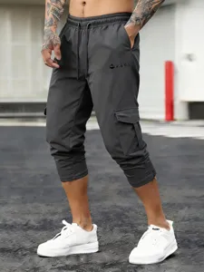 Men's dark grey cargo capri pants with elastic drawstring waist and multi-pocket detail.