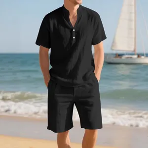 Men's summer casual two piece set solid color short sleeve shirt and shorts beach outfit.
