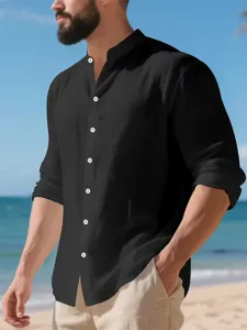 Detail view of men's black linen long-sleeve shirt with mandarin collar and white buttons.