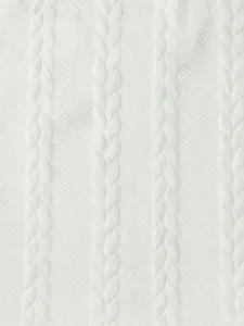 Close-up of white cable knit fabric texture with breathable mesh weave detail for apparel.
