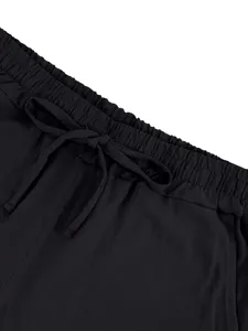 Close-up detail of black men's casual shorts waistband with adjustable drawstring and elastic design.