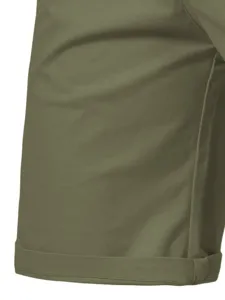 Close-up detail of men's outdoor casual cargo shorts fabric and hem texture in green.