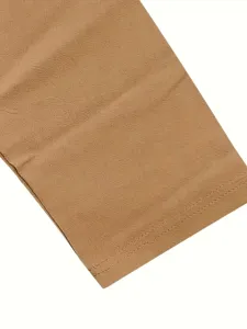 Close-up detail of casual menswear fabric texture and neat stitching in light brown color.