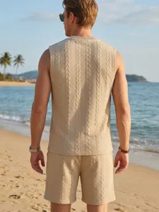 Detailed view of men's knit vest and shorts set on beach, breathable cable knit design.