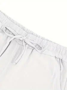 Detailed view of men's casual linen shorts elastic drawstring waistband white summer apparel