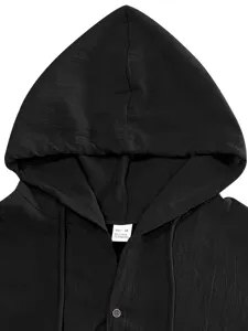Close-up detail of black linen blend hooded sleeveless shirt collar and hood texture.