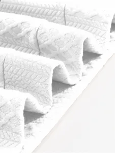 Men's hoodie fabric detail close up showing soft texture and woven pattern design.