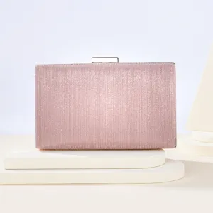 Pink glitter clutch detail view, featuring sparkling finish and a sleek metal clasp closure.