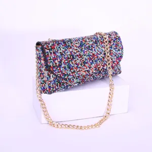 Elegant sparkling rhinestone evening bag with gold chain strap detail for party and events.