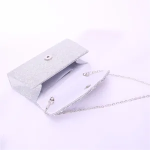 Silver glitter evening clutch bag detail view, sparkling rhinestone party handbag for women wedding.
