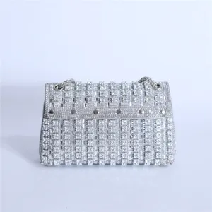 Exquisite rhinestone encrusted detail of the elegant evening shoulder bag with sparkling diamonds.
