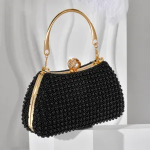 Detailed view of black beaded evening clutch with gold handle, dimensions 21.5x12.5x8cm, weight 541g.