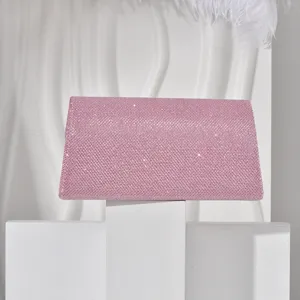Detailed view of elegant pink glitter evening bag, chic shimmering clutch purse for women.
