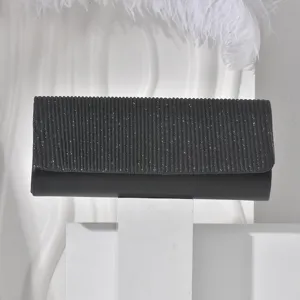 Black glitter clutch bag detailed view, elegant evening purse for women banquets.