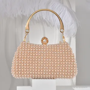 Pearl evening clutch detail, elegant gold metal handle and clasp for banquet dress.