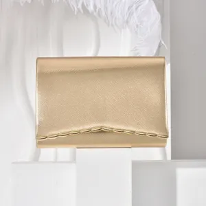 Gold metallic evening clutch bag with chic wave trim, elegant cross-border fashion accessory