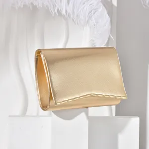 Gold metallic clutch evening bag for women, elegant envelope handbag with magnetic closure.