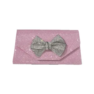 Pink glitter evening clutch bag with sparkling rhinestone bow for women party wedding main view.