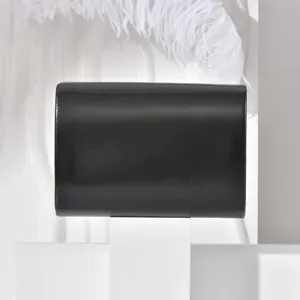 Black envelope clutch evening bag, elegant minimalist design for parties and weddings.