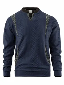 Detail view of mens long sleeve knit sweater with stylish plaid V-neck insert, dark blue color.