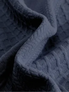 Men's sweatshirt fabric detail close-up, premium dark blue textured knit material.
