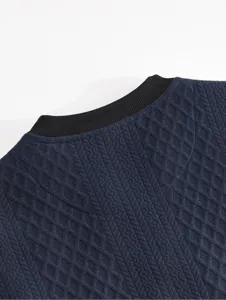 Detail view of mens navy blue textured crewneck sweatshirt collar, casual long sleeve pullover.