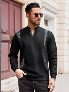 Detail view of a stylish black knit sweater with plaid accents and long sleeves for men.